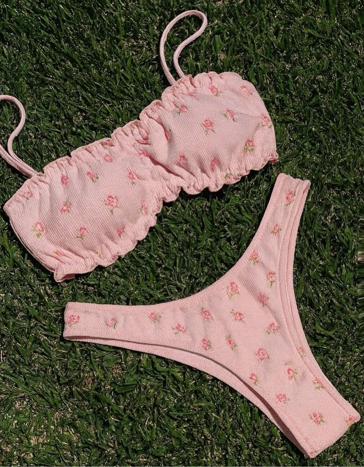 Zana Gorman Picnic Set soft pink floral bikini on pastel blanket, feminine ribbed texture, luxury beachwear with picnic. Designed by Zana Gorman 