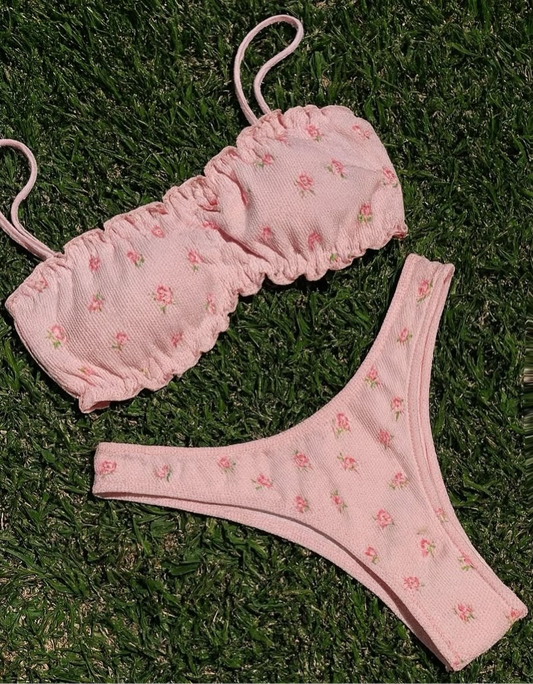 Zana Gorman Picnic Set soft pink floral bikini on pastel blanket, feminine ribbed texture, luxury beachwear with picnic. Designed by Zana Gorman 